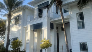Professional house washing Cape Coral home using soft wash cleaning for safe and even exterior results