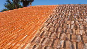 Before and after comparison of tile roof soft wash cleaning in Cape Coral, showing the dramatic improvement.