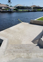 Seawall and boat dock pressure washing in Estero, FL, eliminating algae, barnacles, and salt buildup for better maintenance.