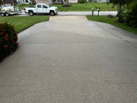 concrete driveway after pressure washing service in Cape Coral, showcasing a spotless and renewed surface.
