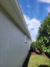 Complete exterior house pressure washing with low-pressure gutter and soffit cleaning in Cape Coral by AAA Pressure Washing.