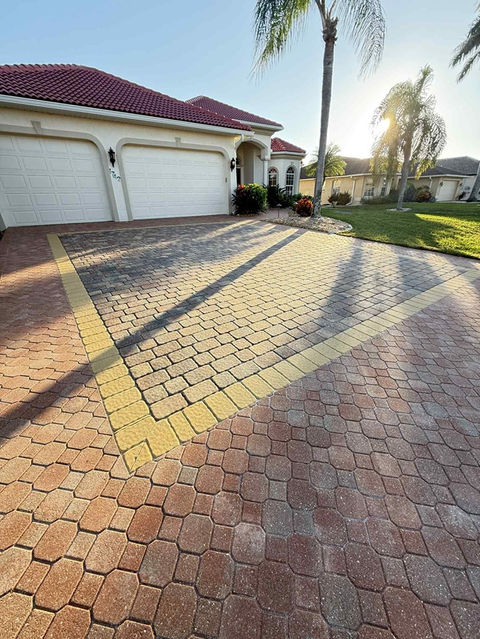 Driveway pavers in Cape Coral showing clean, restored color and a fresh sealed finish after professional paver sealing service.