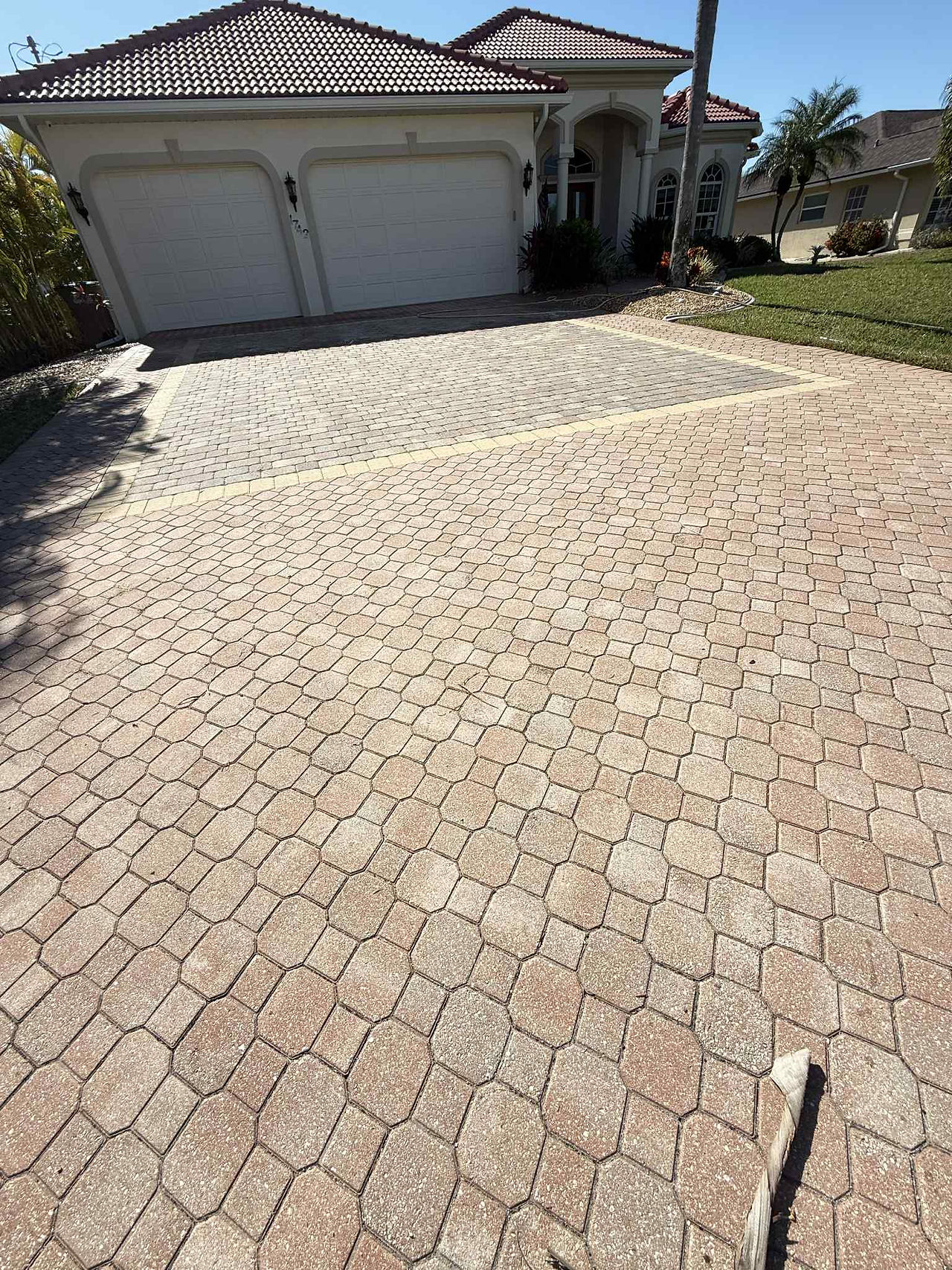 Before photo of a dull, dirty paver driveway in Cape Coral showing faded color and surface buildup before professional pressure washing.