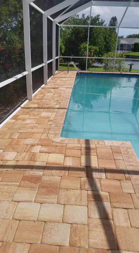 Pool patio deck pavers awaiting cleaning in Cape Coral.