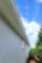 AAA Pressure Washing performing low-pressure house washing and gutter cleaning in Cape Coral to safely remove mold, algae, and buildup.