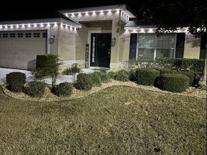 Handyman Dade City installing permanent Christmas lights on a home in Asbel Estates, Land O’ Lakes FL