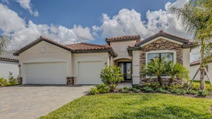 A beautifully maintained home with a freshly pressure-washed driveway, walkway, and siding, enhancing curb appeal and making a strong first impression for potential buyers