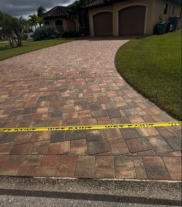Driveway, entryway, and pool patio restored with professional cleaning and Paver Sealing Cape Coral services by AAA Pressure Washing, showing vibrant, protected paver surfaces.
