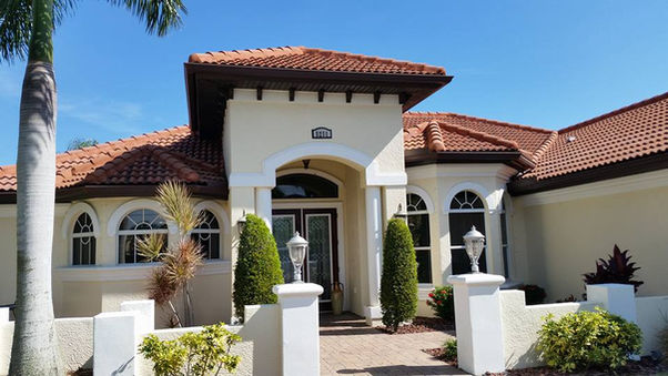 Whole house and roof cleaning service in Cape Coral, featuring a clean exterior and freshly washed roof.