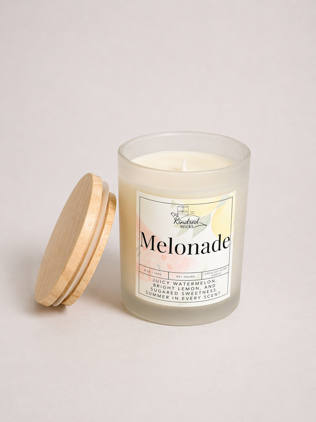 Frosted glass candle with Melonade label and wooden lid