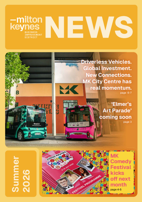 Milton Keynes News cover with two colorful buses, headlines on driverless vehicles and art parade, plus Summer 2026 comedy festival panel.