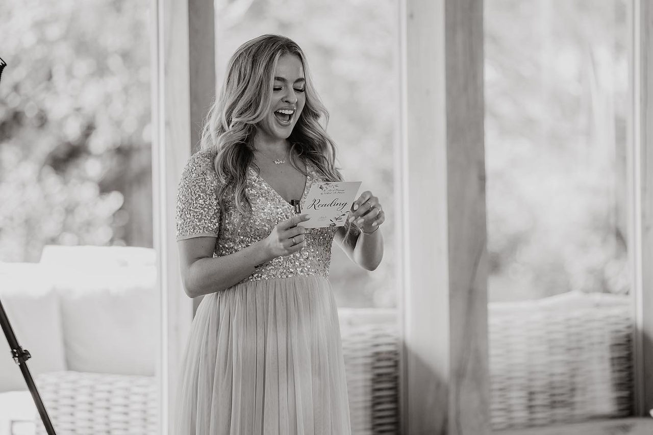 Bridesmaid giving a reading - black and white photo