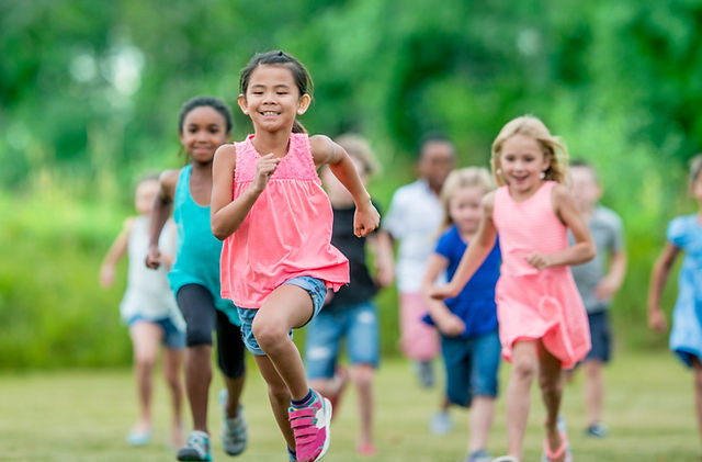 Huron County Children's Special Health Care Services Program Children racing in a field