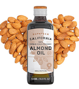 Sunnygem almond oil with almonds in the background