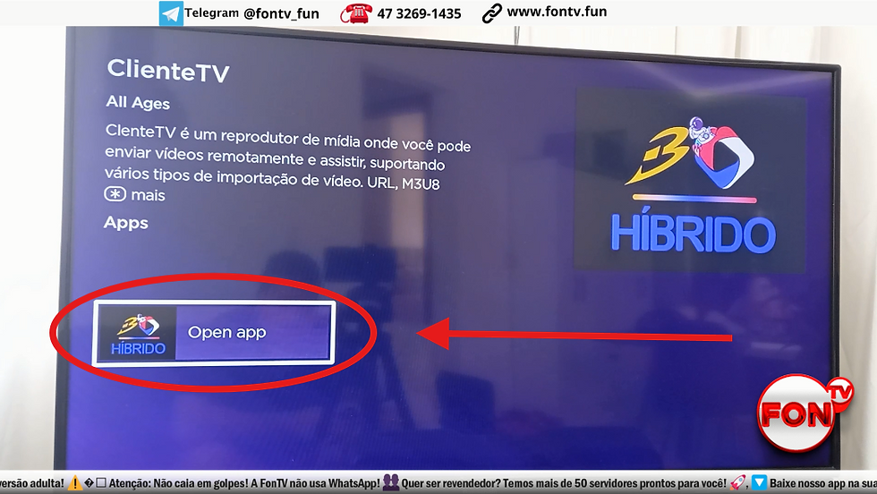Tela de TV mostrando um aplicativo chamado "HÍBRIDO" destacado para seleção com o botão "Abrir aplicativo".