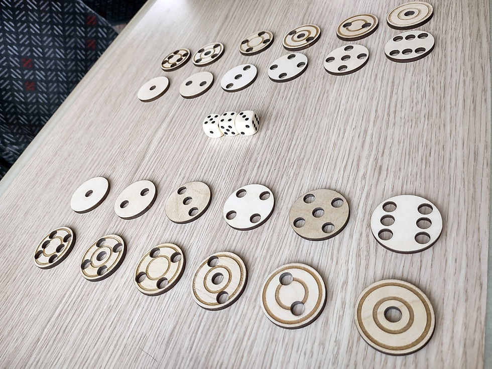 Initial setup for a game of Peruke being played on a wooden table. In the foreground, a row of six wooden discs numbered 1-6 like a die turned to their vulnerable side (with concentric circle ridges carved into them) are below a row of invulnerable discs, also numbered 1-6. In the background are three white six-sided dice used to play the game, with the opponent's discs laid out in the same way as those in the foreground.