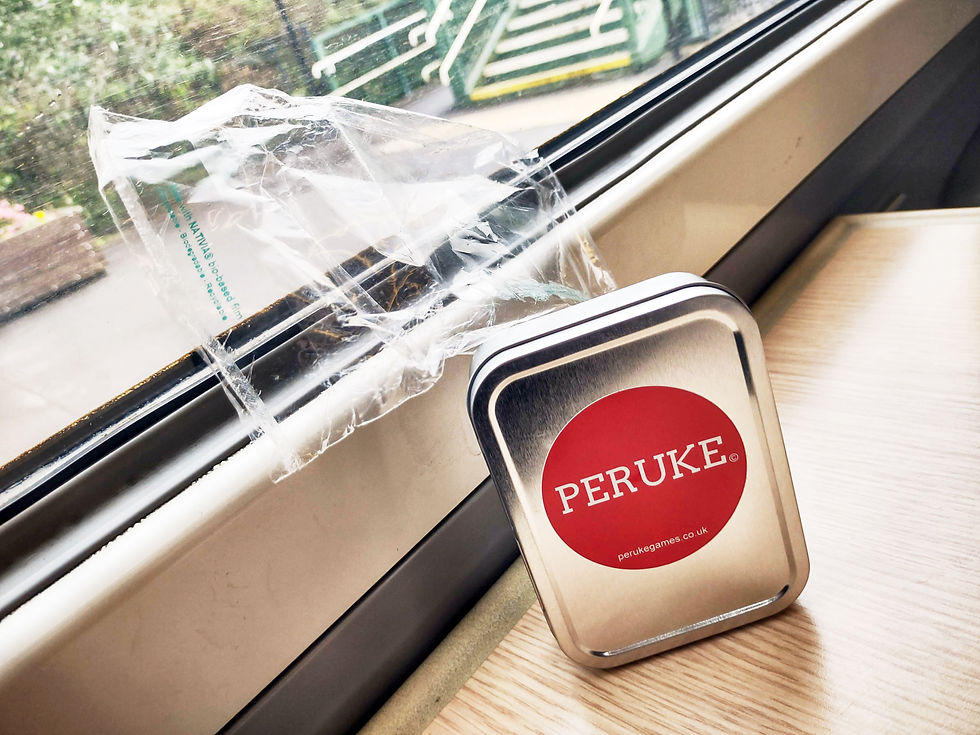 The Peruke tin pictured next to its transparent plastic bag.