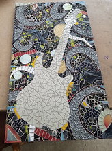 "Fender Strat" - mirror and glass mosaic, with lots of interesting bits and pieces added in.