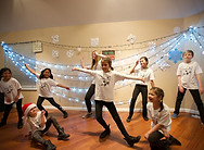 Queen's Academy performers dancing on stage