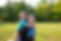 A camper and staff member smile for a photo during a camp wide game. 