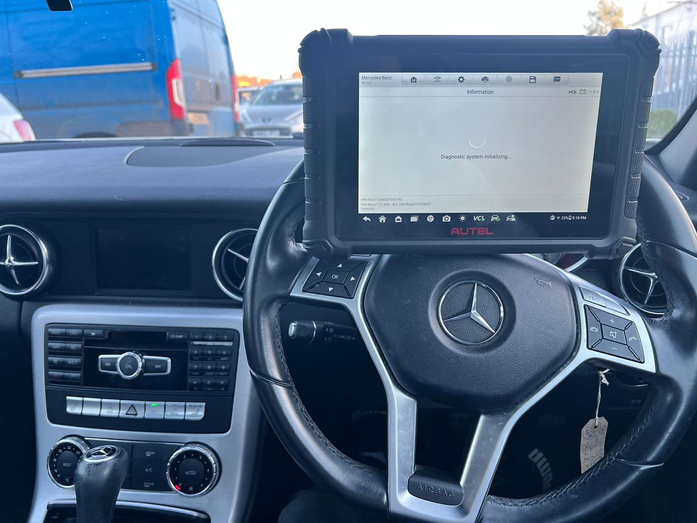 Advanced mobile vehicle diagnostics being performed on a Mercedes-Benz using an Autel professional scan tool to identify and clear engine faults.