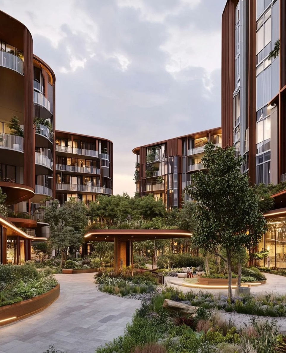 Curved timber-clad residences around a landscaped resort courtyard at dusk