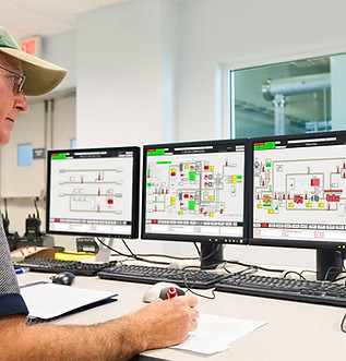 Image of a man monitoring a scada screen