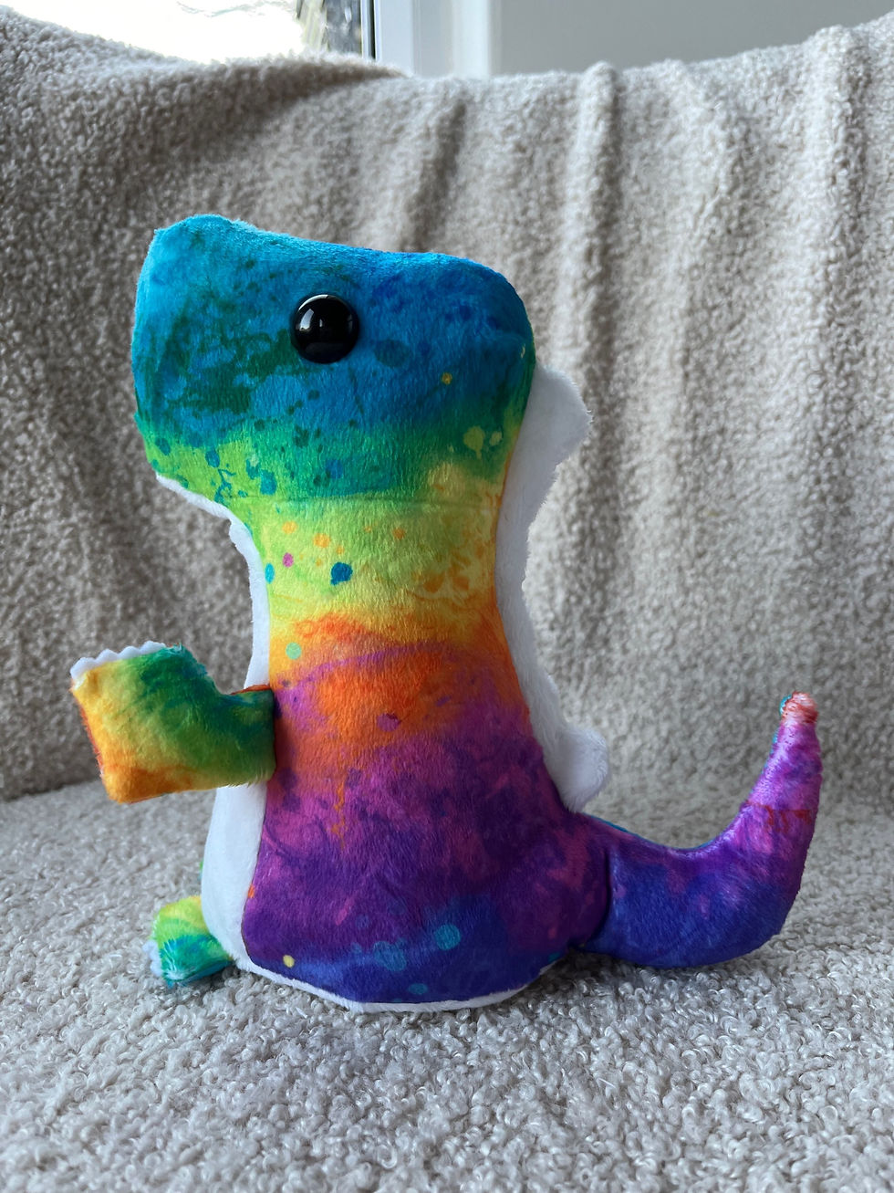 Thumbnail: rainbow coloured dinosaur plush