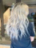 Bright platinum blonde with soft dimensional depth, seamless blending, and textured moveme