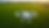 High angle view of a drone flying over a green agricultural field