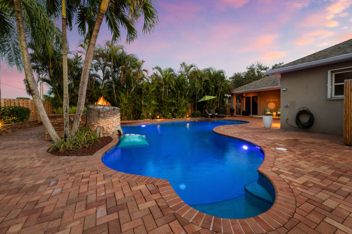 Drone photography of a luxury home at sunset, showcasing real estate marketing visuals