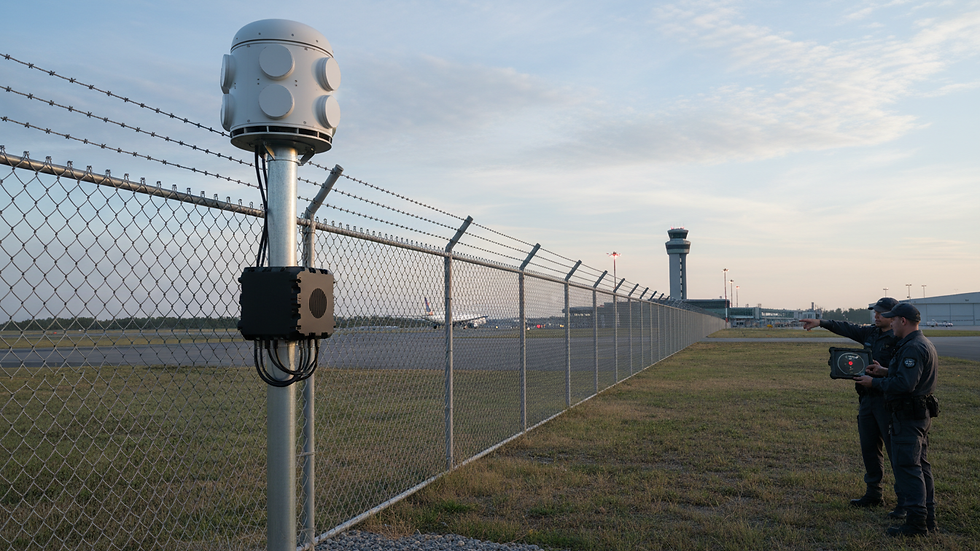 Eye-level view of drone detection radar system installed near airport perimeter fence