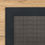 Thumbnail: Montawk rug with a dark gray border on a wooden floor.