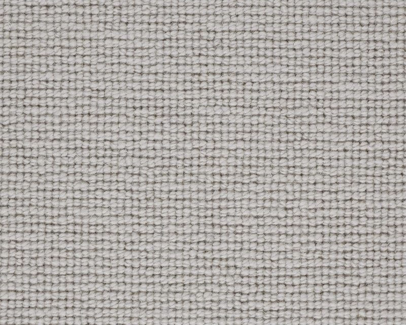 Close-up of a light grey woven fabric texture, showing a tight knit pattern.
