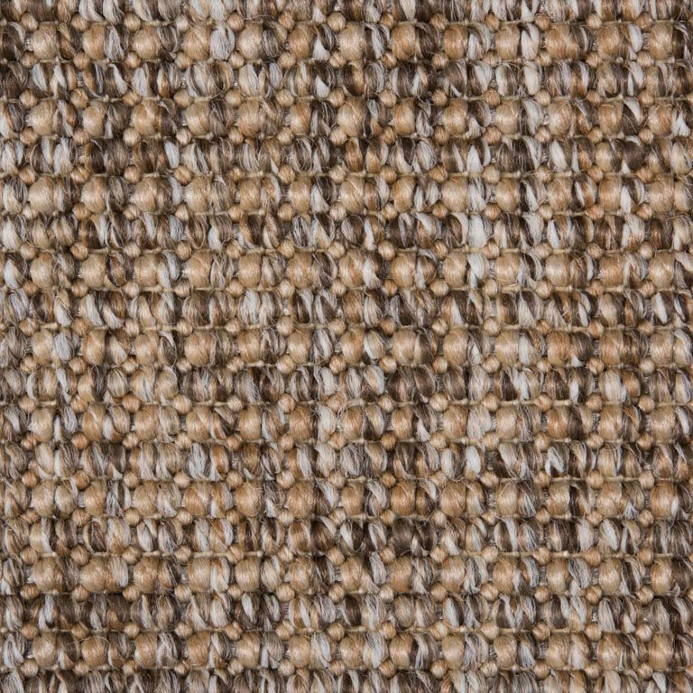 Close-up of woven textured carpet in beige, brown, and cream.