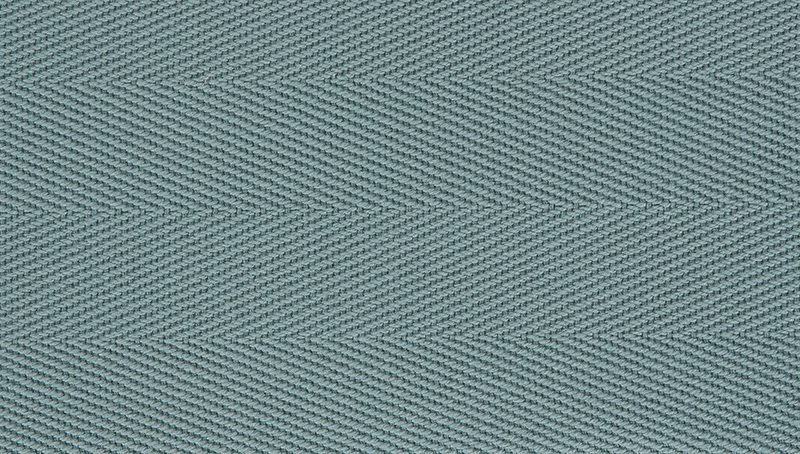 Thumbnail: Close-up of a blue seagrass rug with a herringbone weave pattern.