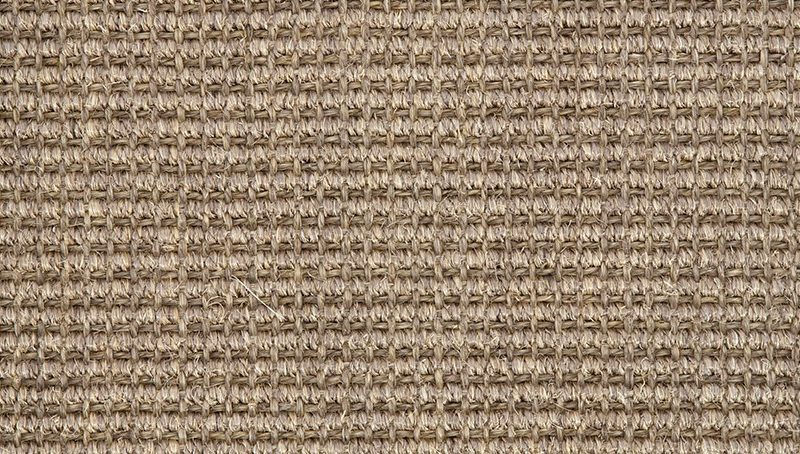 Close-up of antique gold boucle fabric texture.