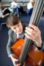middle-school-student-playing-double-bass-in-music-2026-03-26-09-15-49-utc.jpg