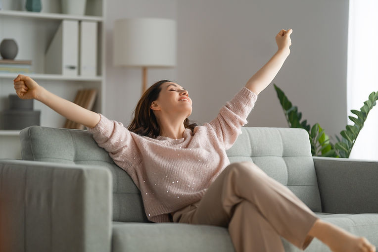 woman sighing on clean couch