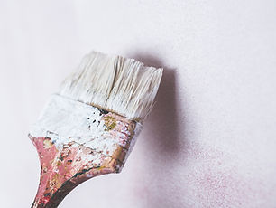 Image of a paintbrush in white paint