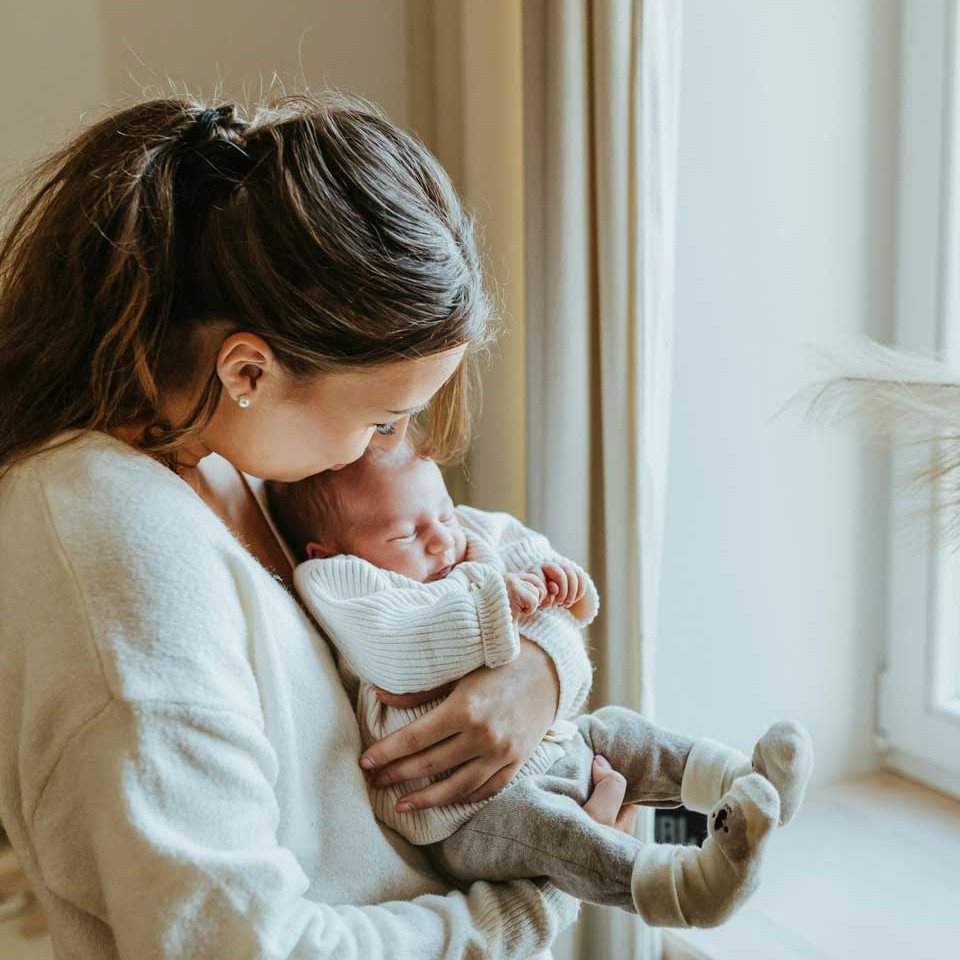 Mum holding newborn baby looking for breastfeeding support in Wymondham, Norwich, Norfolk