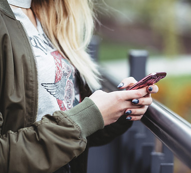 Woman Holding a Mobile Phone