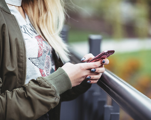 Woman Holding a Mobile Phone