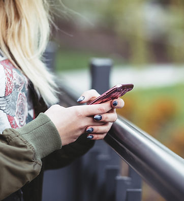 Woman Holding a Mobile Phone