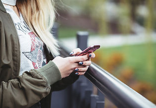 Woman Holding a Mobile Phone