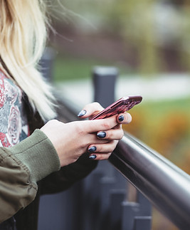 Woman Holding a Mobile Phone