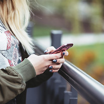 Woman Holding a Mobile Phone