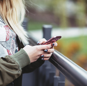 Woman Holding a Mobile Phone