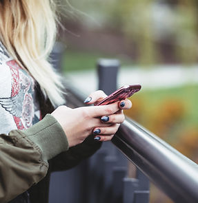 Woman Holding a Mobile Phone