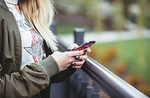 Woman Holding a Mobile Phone